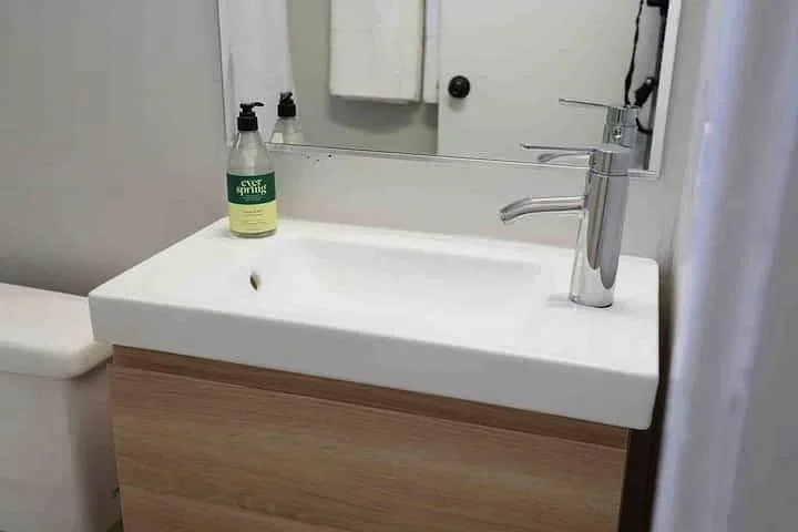 Stylish Modern Apartment in Cameron Village Bathrrom Sink.jpg