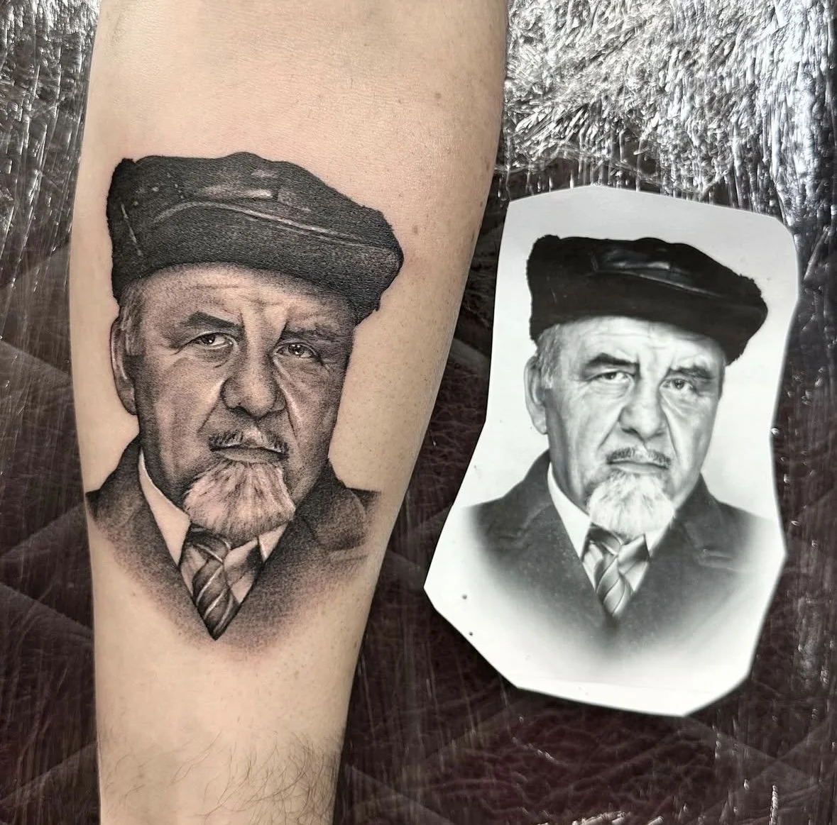 A black and grey realistic portrait tattoo with the photo reference next to it, of a family relative of the client. done by portrait specialist in Bristol, uk, soon to be in Sunshine Coast, near Brisbane, Queensland Australia 