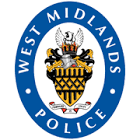 West Midlands Police badge featuring a shield with a lion, a crown, and a ribbon with the words 'West Midlands Police' in a blue circle