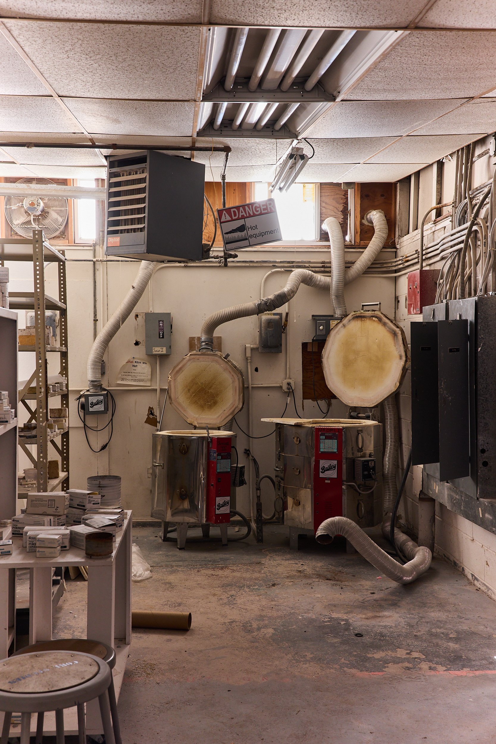 Interior of a ceramic workshop with two kilns and tools