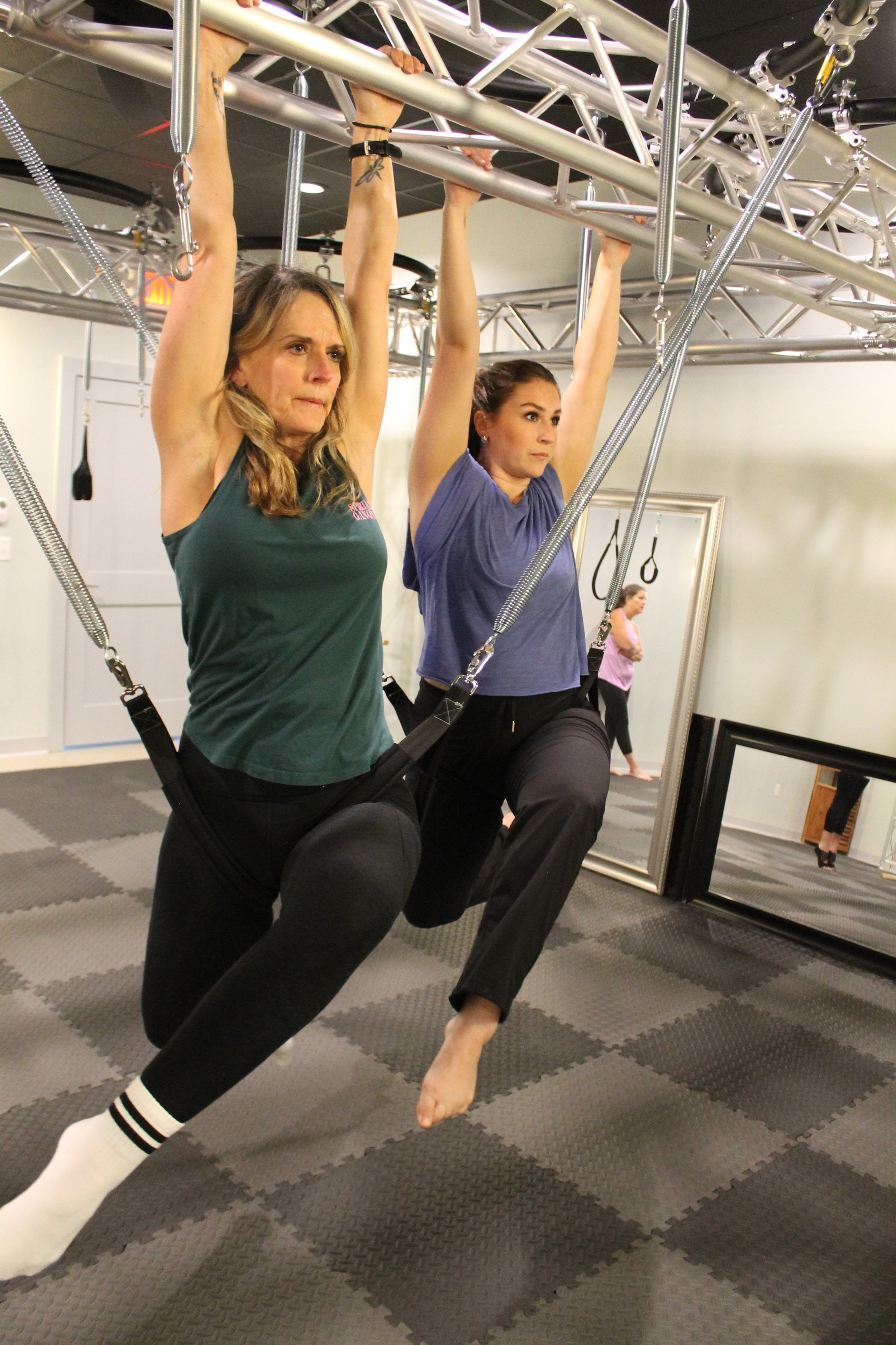 Two women in Fit Springs class at Body & Soul Pilates in Gluckstadt, MS