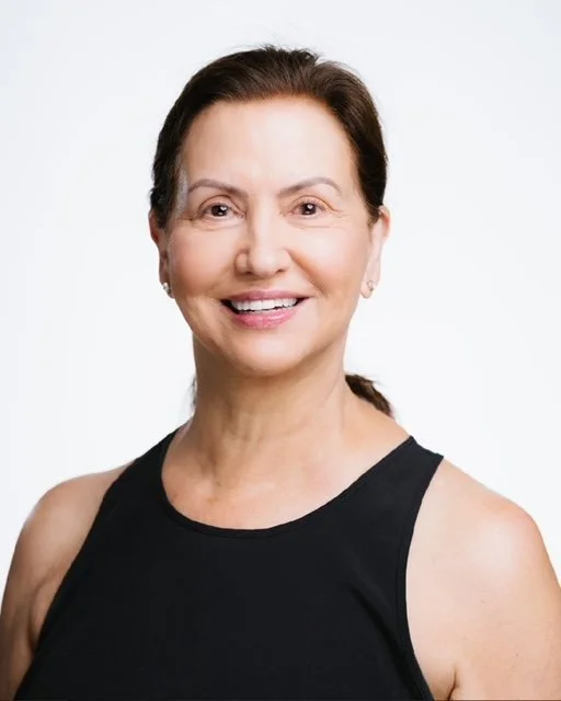 Penny Butler-Harvey, a Gluckstadt, MS Pilates instructor, sitting on a reformer machine at Body & Soul Pilates