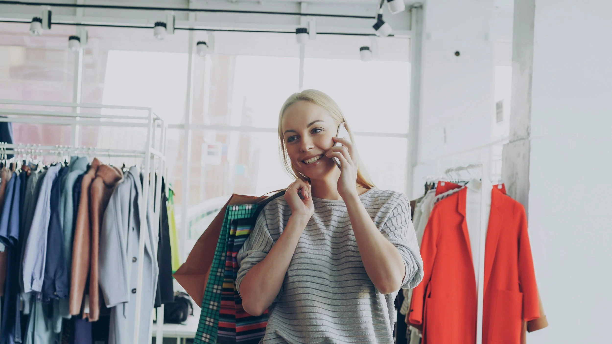 A young woman , talking to Florida Builders, Engineers & inspectors on her cellphone, receiving a quick quote for her pre-purchase inspection.