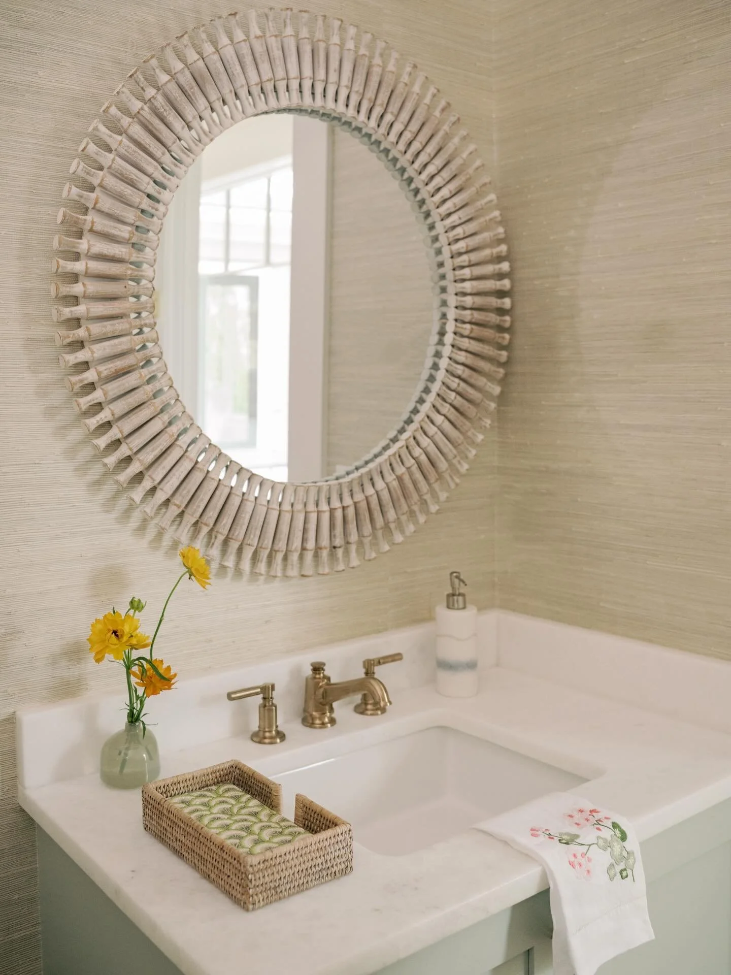 Powder bath details from our Kiawah Island project. We wrapped the room in @phillipjeffriesltd grasscloth to bring warmth and natural texture, and paired it with a soft, serene vanity tone to keep everything feeling calm and coastal. Small room, but 