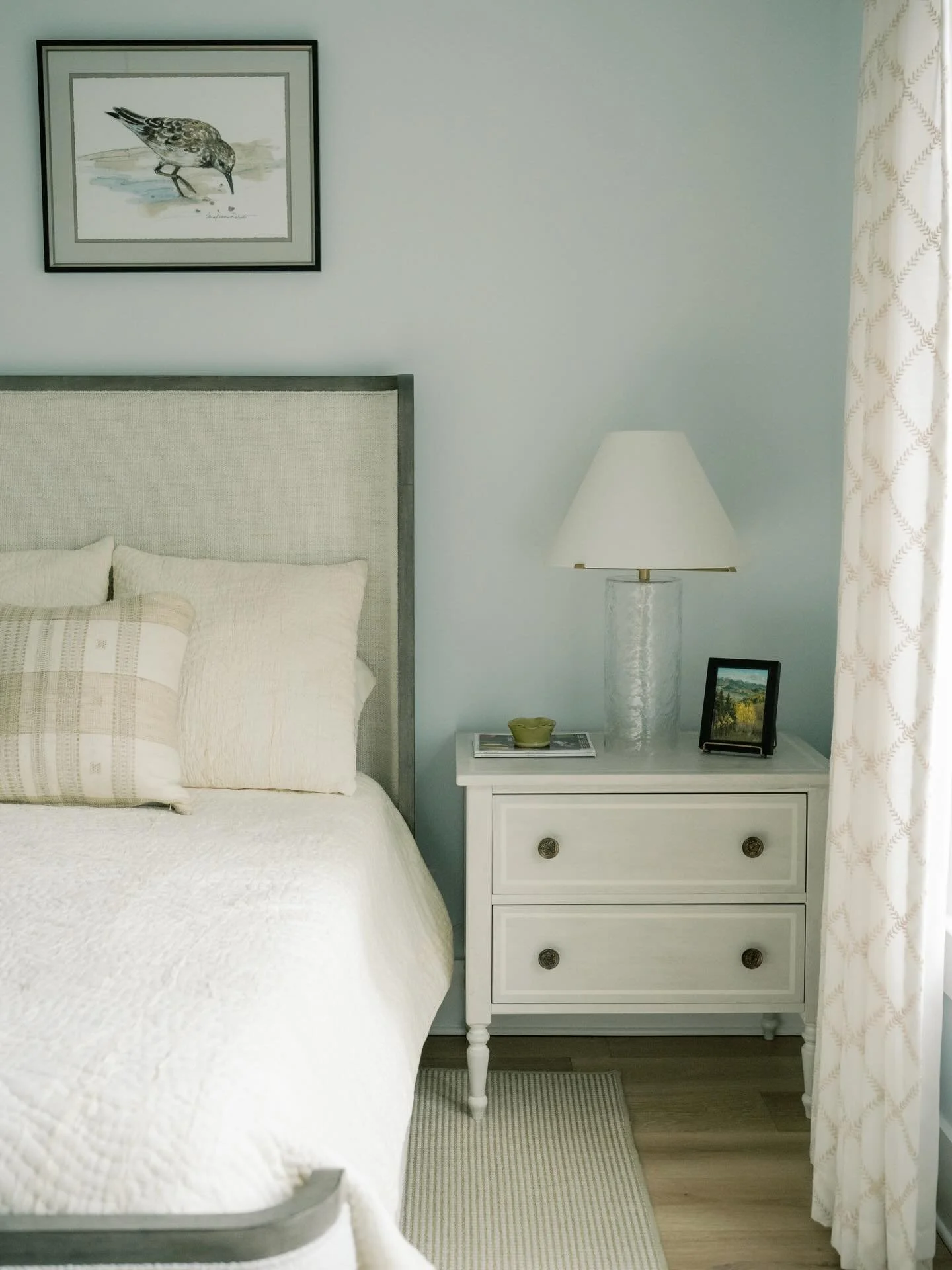 There&rsquo;s something about a soft blue bedroom that instantly slows everything down. Inspired by the coastal surroundings, we kept the palette light and airy while layering in natural textures and tailored silhouettes to ground the space.

The mix