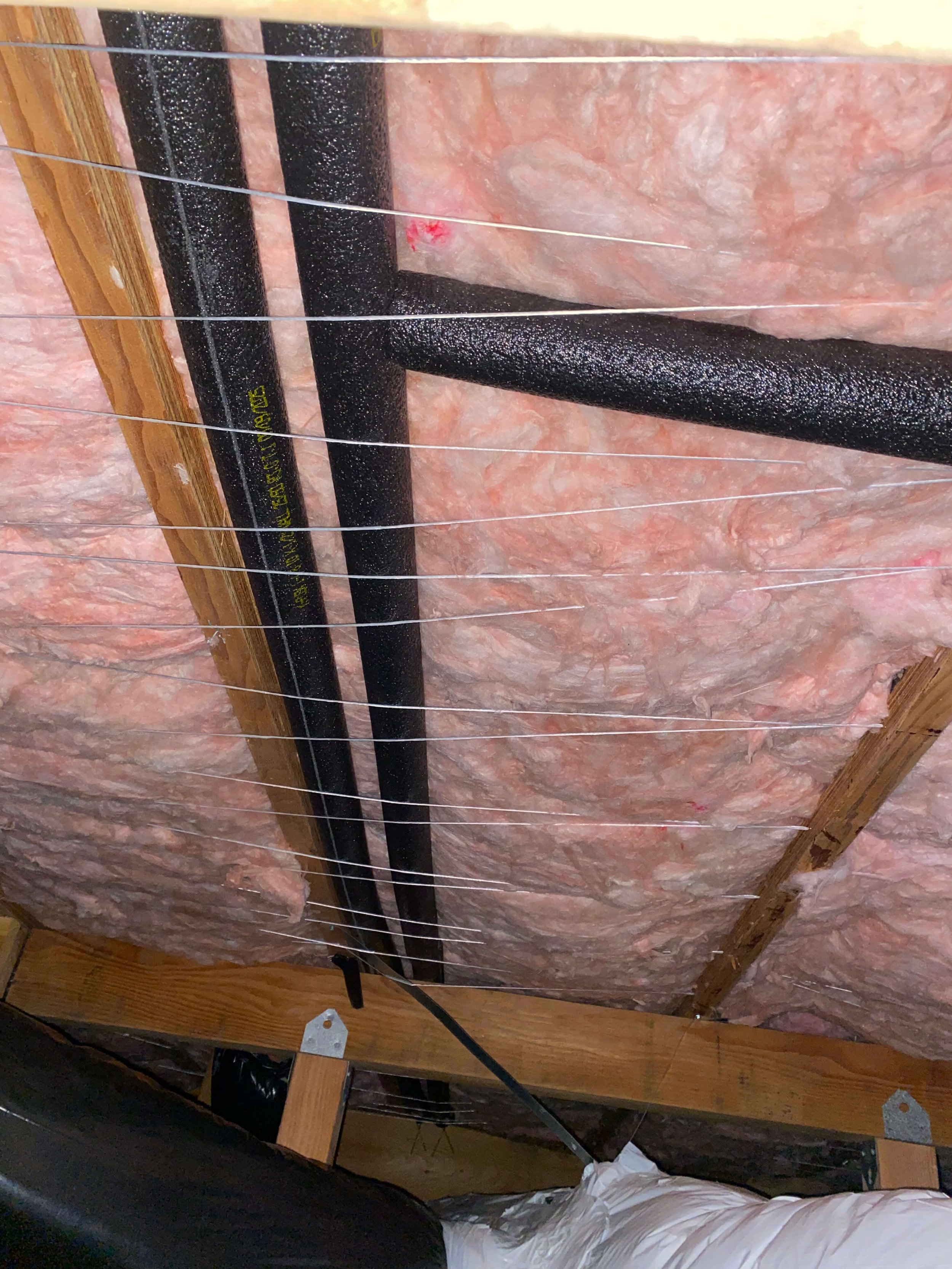 Crawl Space Insulation Professionally Installed in Residential Home.