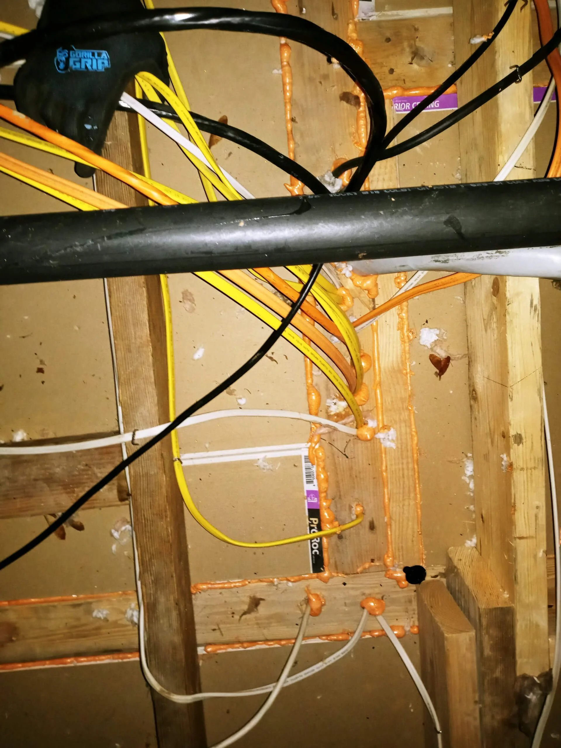 Air sealing of holes around framing and wiring.