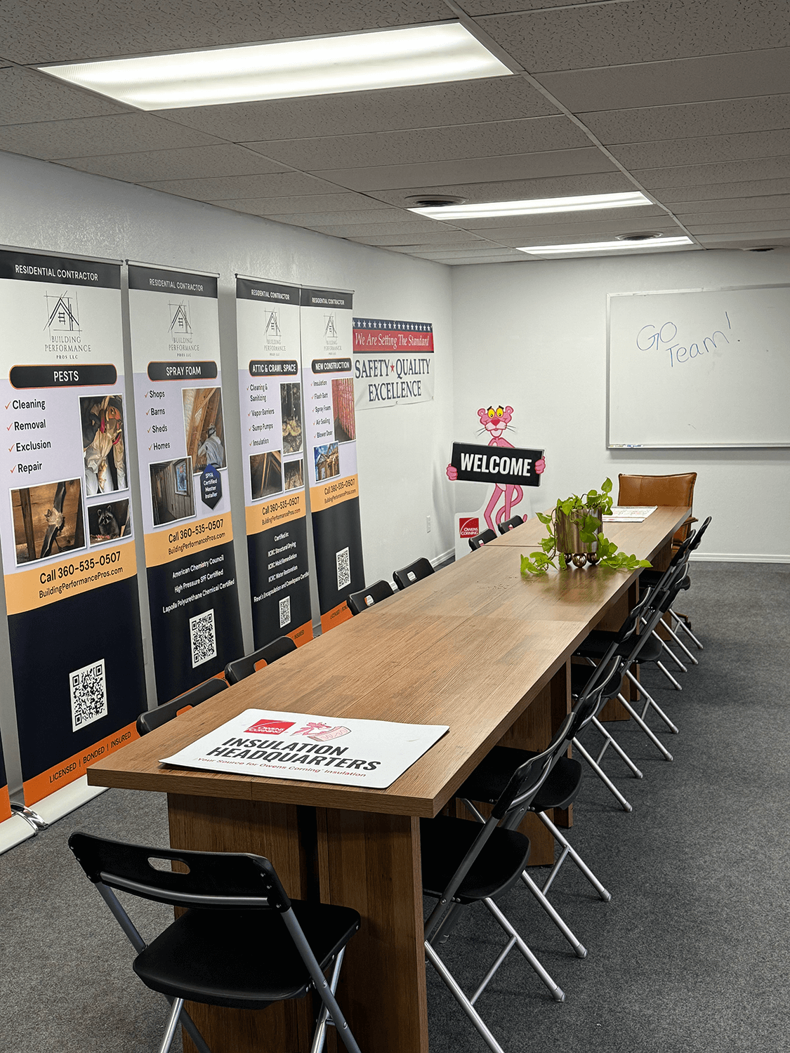 Interior of Building Performance Pros Headquarters and conference room with Owens Corning binder on a table in the foreground.