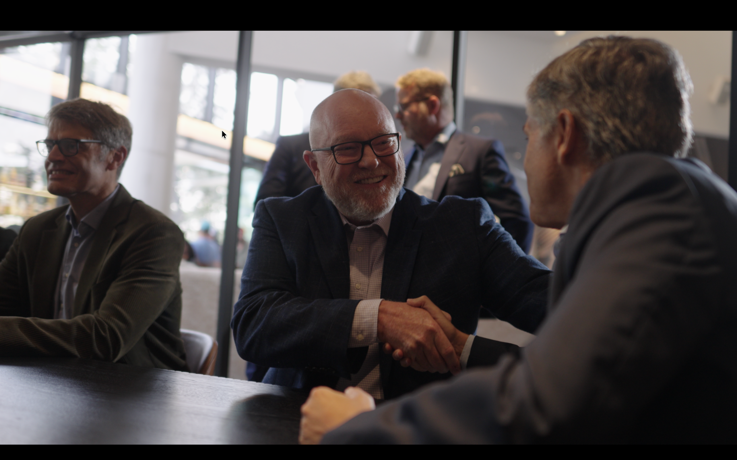 Business leaders networking during a corporate video production in Texas