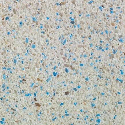 Close-up of speckled terrazzo flooring with beige and blue chips.