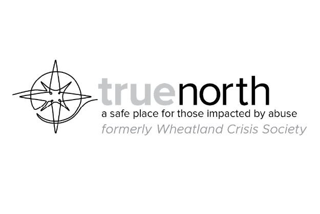 Logo for True North, formerly Wheatland Crisis Society, with a compass and star design.