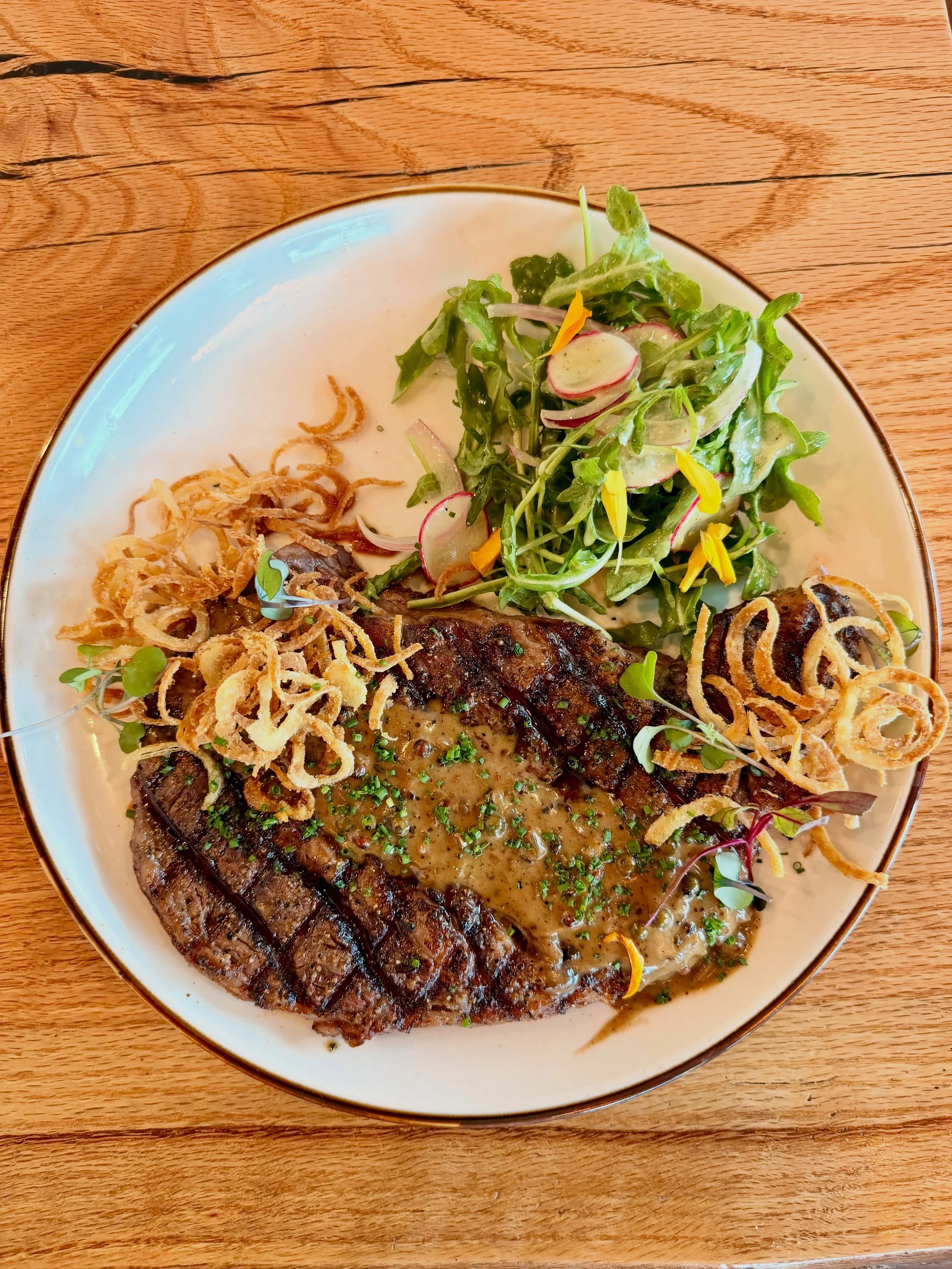 We recently installed a Grill, and that was a game changer. If you liked our steaks before, well now you&rsquo;ll love them even more.

The Lucky 8 - 16oz Hand-Cut Ribeye, Au Poivre, fried shallots, arugula salad. 

Cheers Y&rsquo;all, it&rsquo;s the