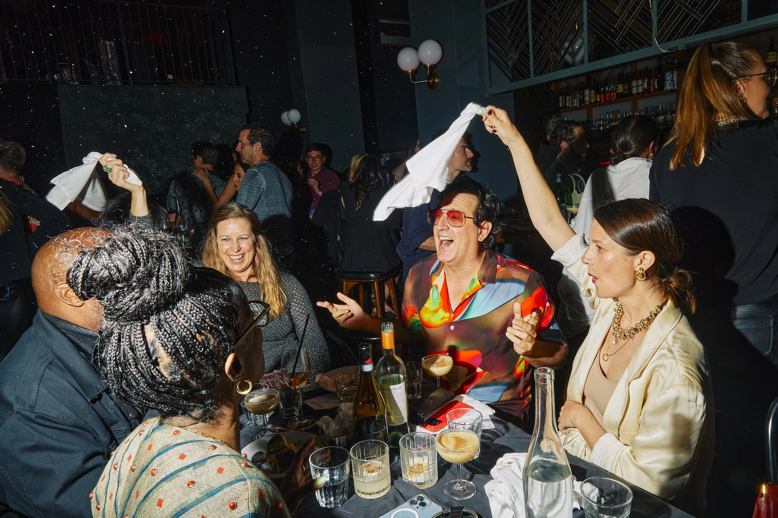 Private event photography capturing energy and movement while dining at a private dinner for Rigatoni Club at Zinqué