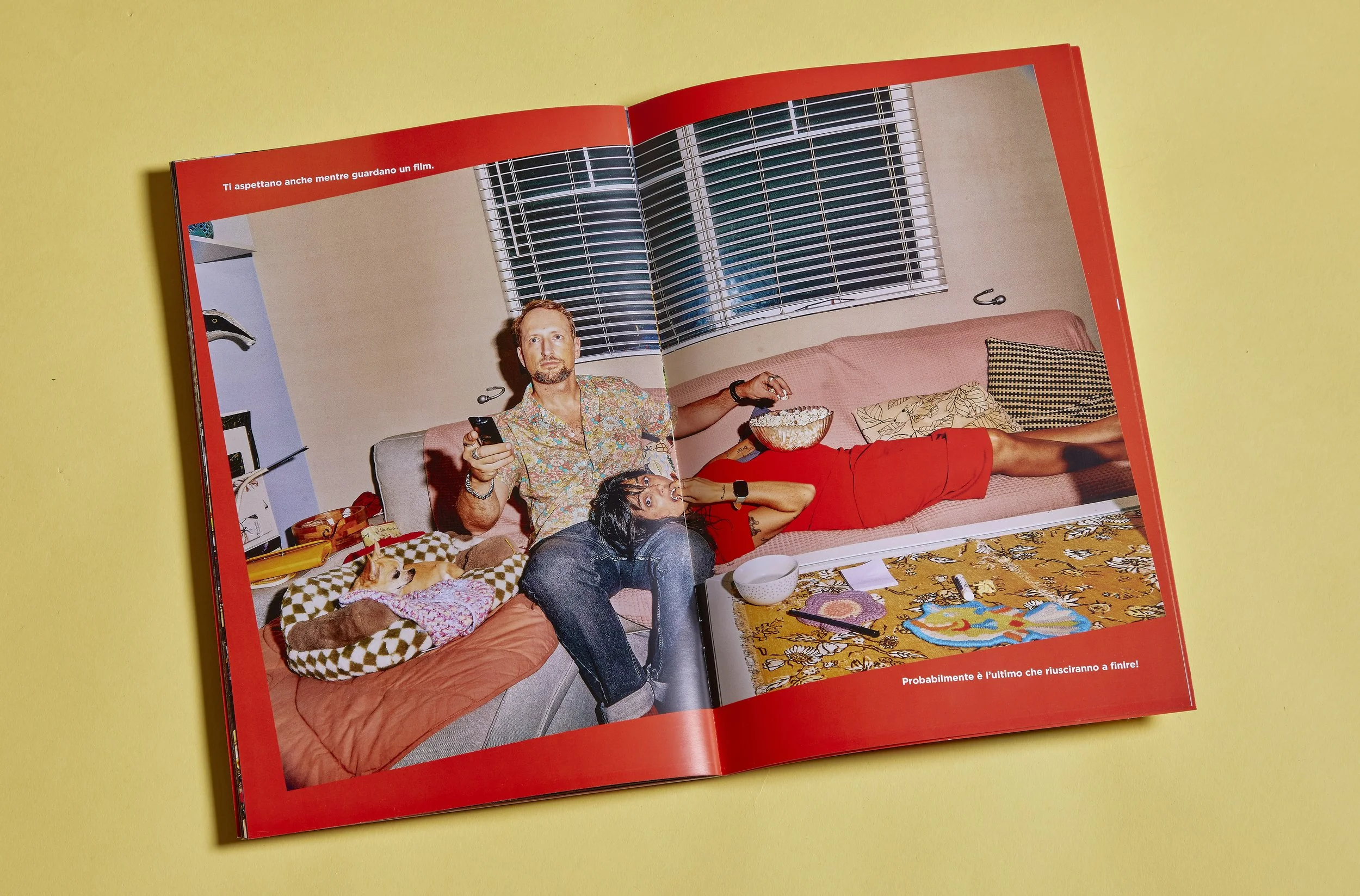 Editorial photography of a family storybook open on an interior spread showing an expecting couple at home.