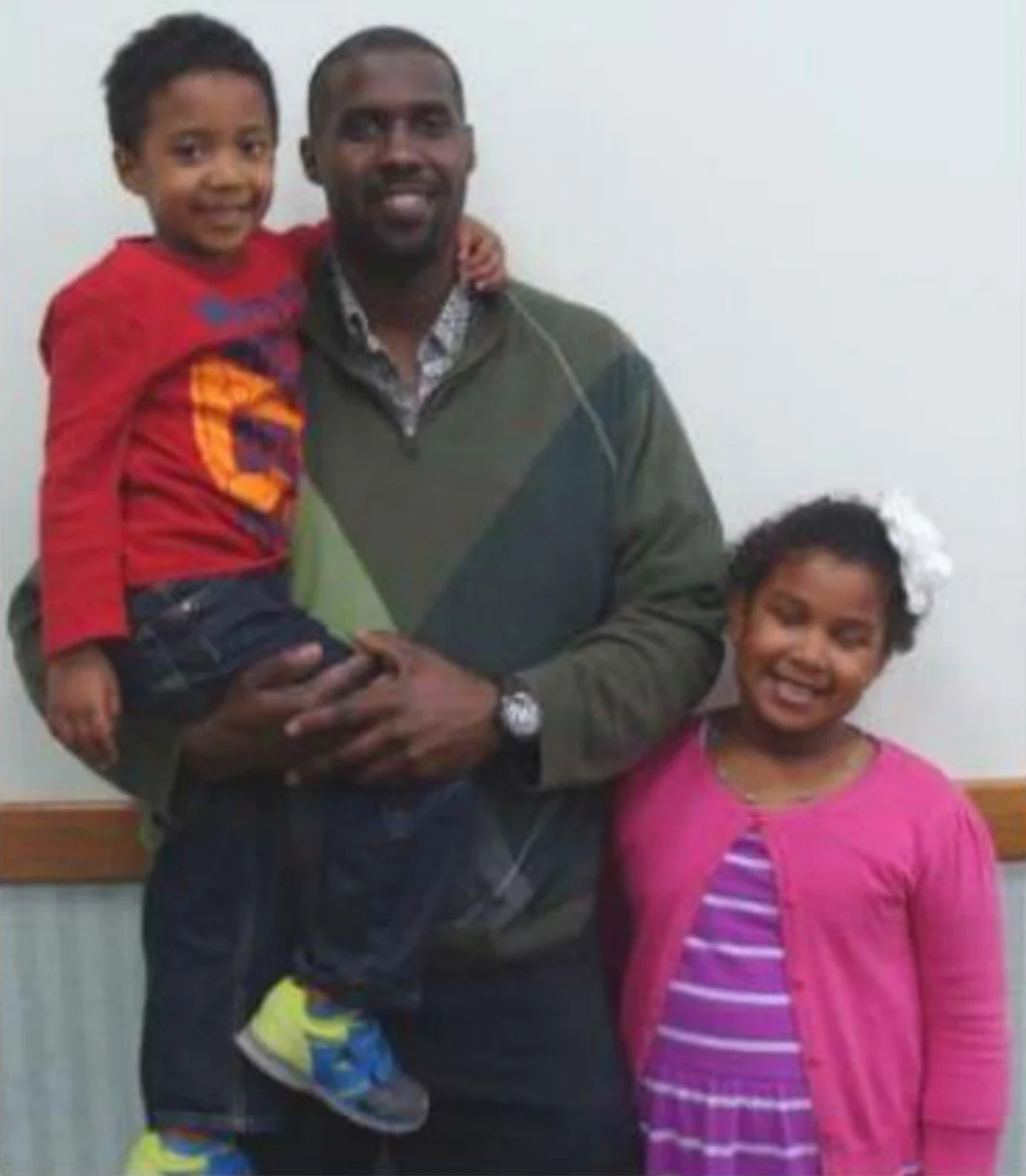 john with his two children photo taken around year 2012