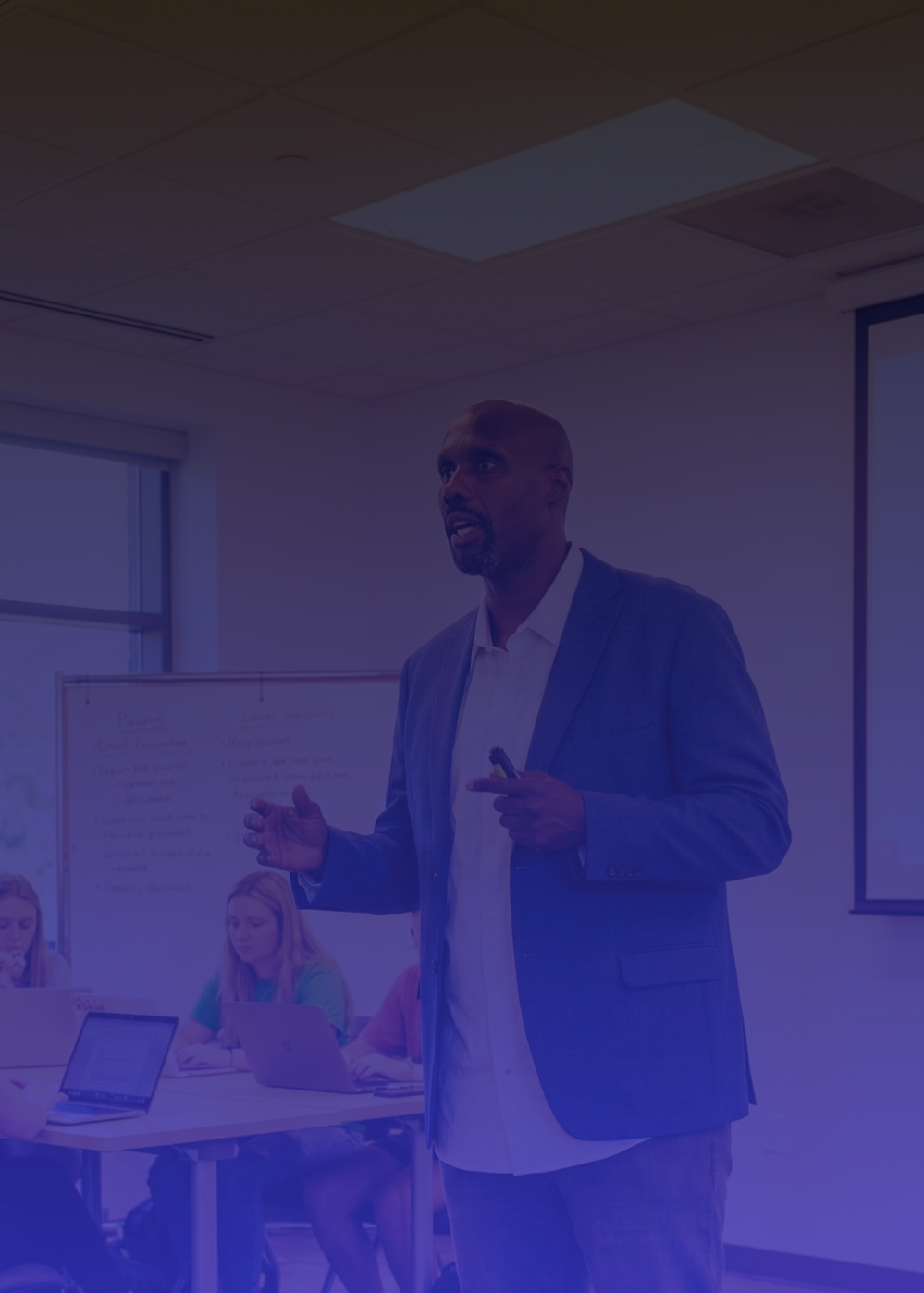 john speaking in a classroom