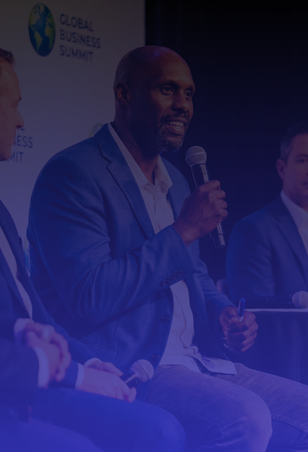 john speaking during a panel discussion