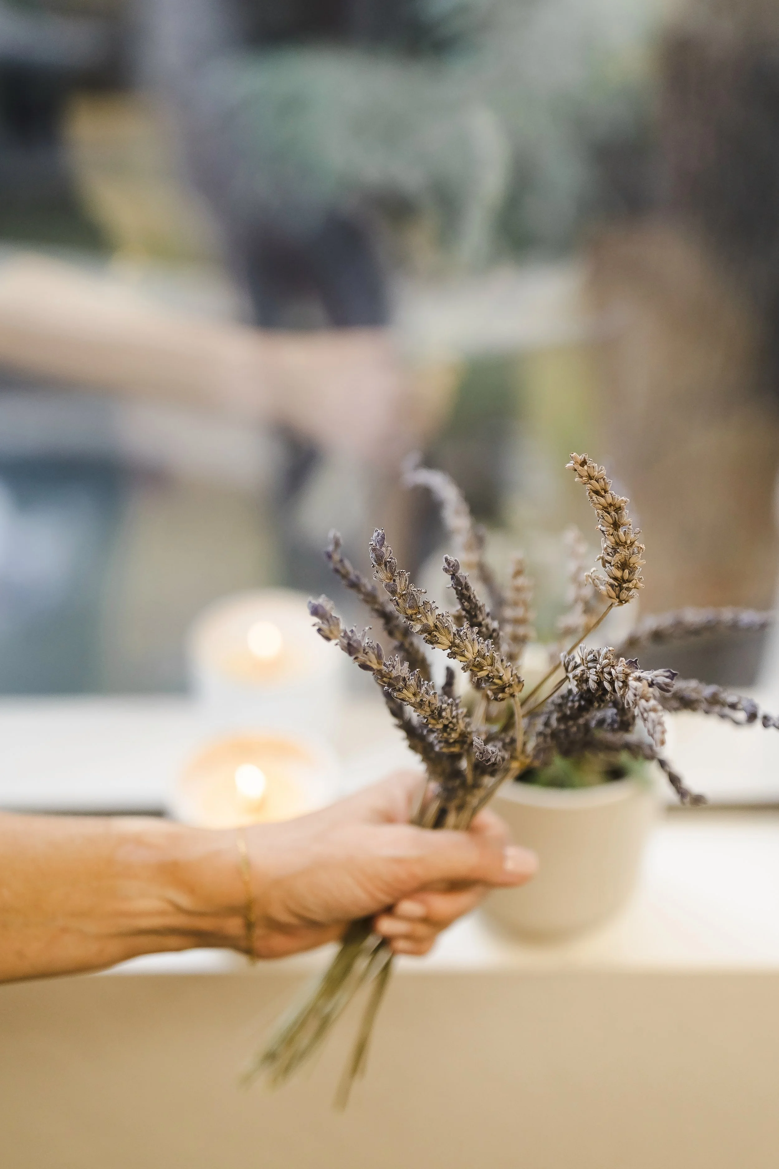 Person holding lavender to show calming vibe of therapy office