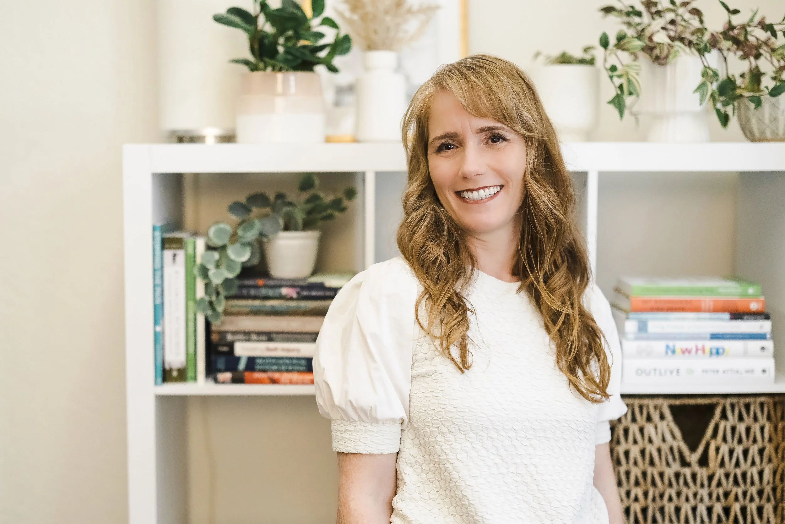 Women smiling in a therapist office