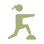 A simple green icon of a person running or jumping