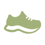 A light green athletic shoe with a black sole.