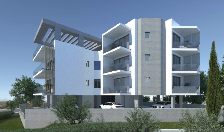 Modern multi-story residential building with balconies, parking underneath, and surrounding greenery.