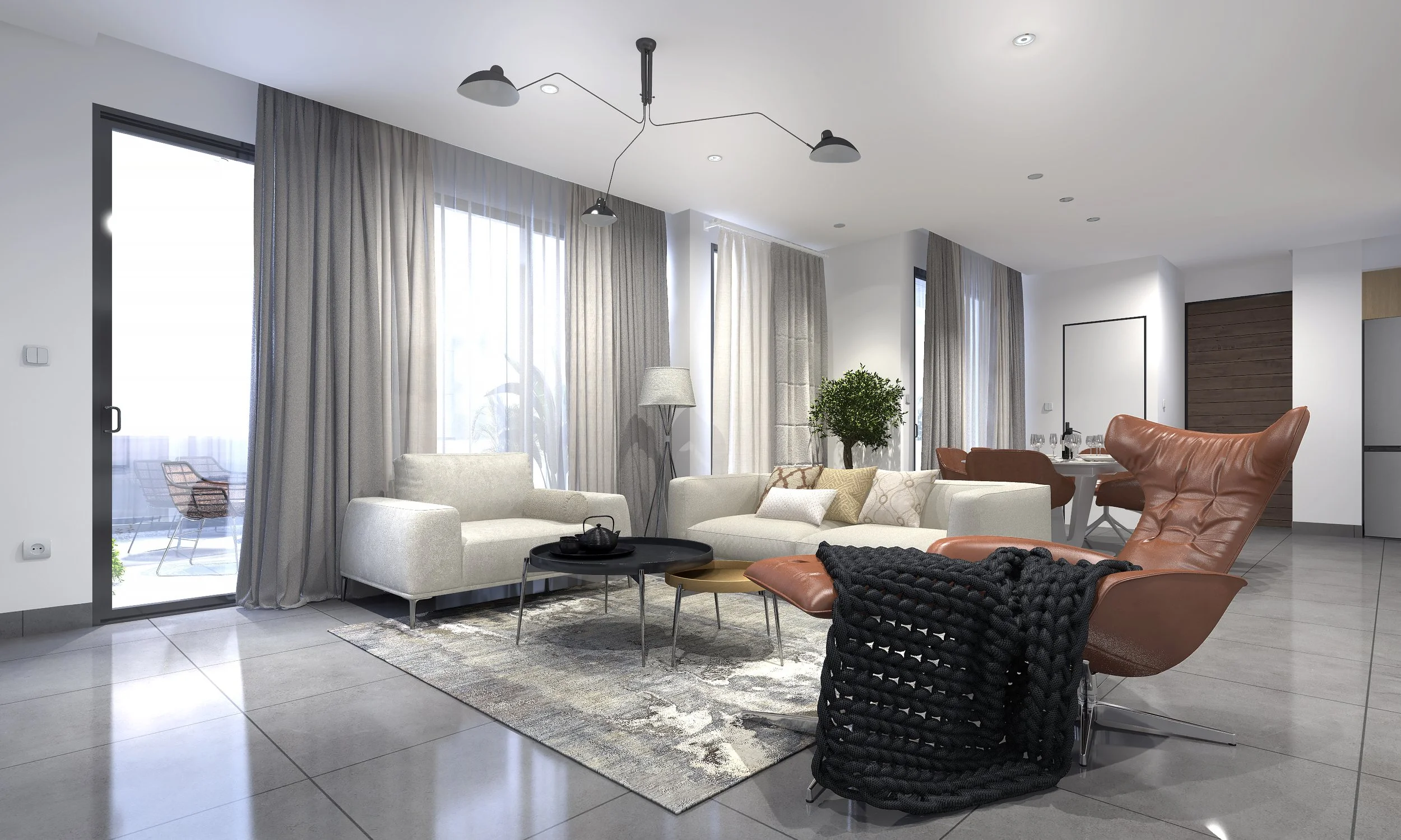Modern living room with white sofas, a brown leather lounge chair with a chunky black throw, a round black coffee table, large curtains, and a dining area in the background.