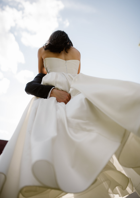 Wedding Couple in Minimalist Gown.png
