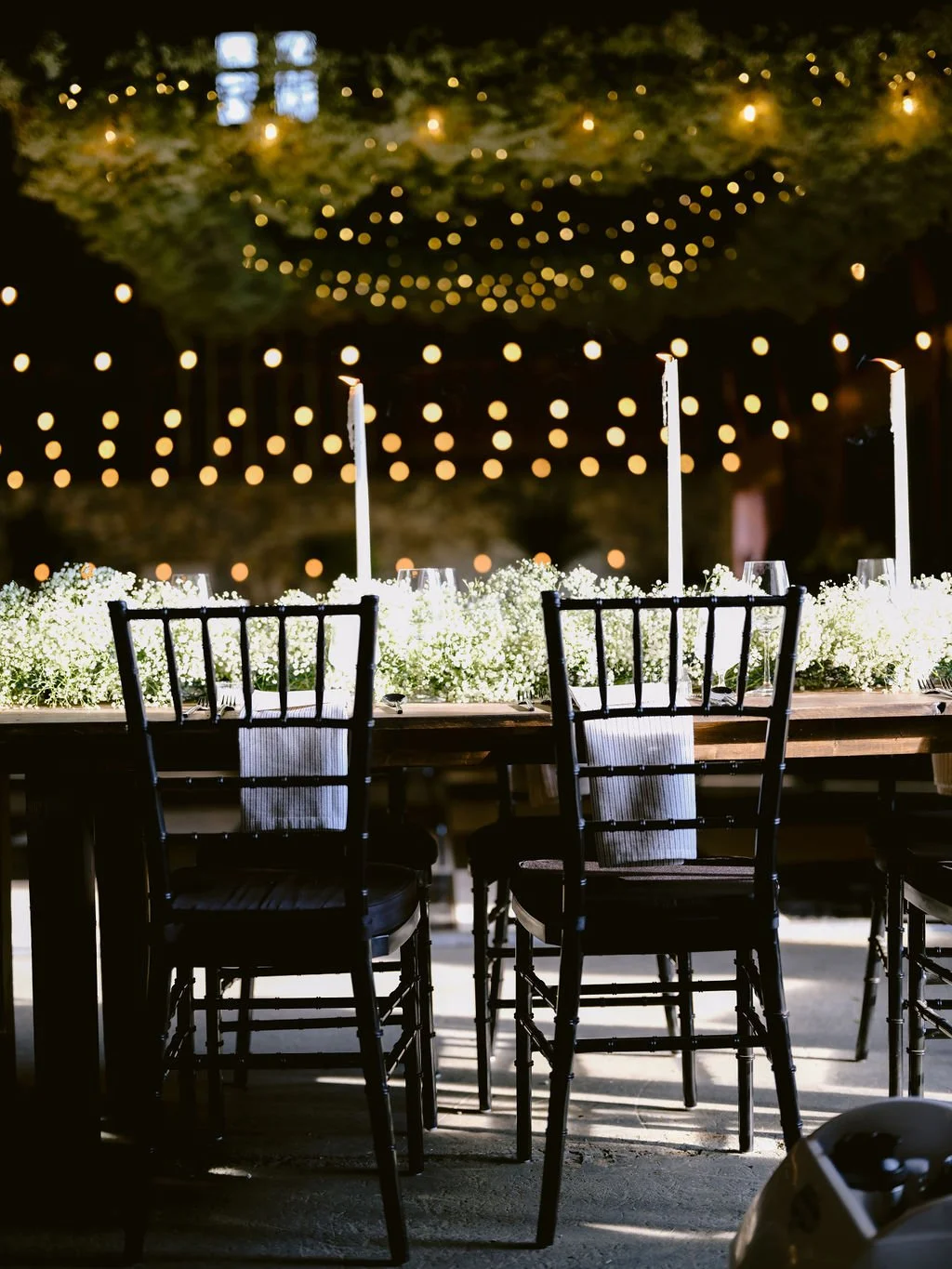 Lighting with Black Chaivari Chairs Wedding.jpg