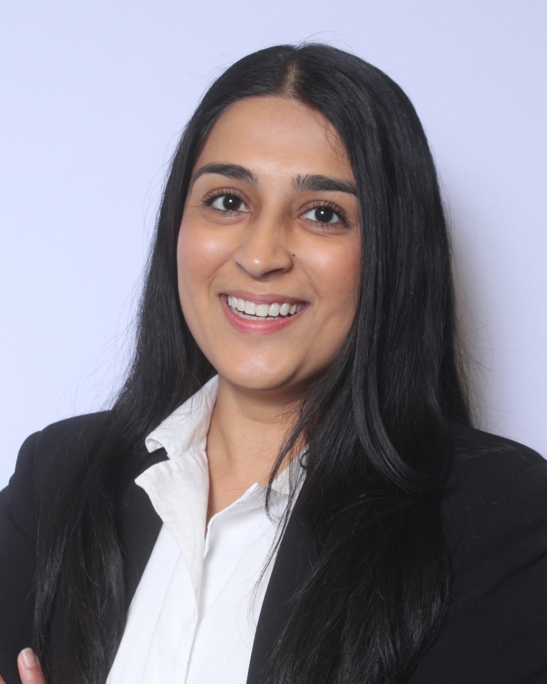 Portrait of a professional HR consultant wearing a black blazer, representing thoughtful, people-first hiring support.