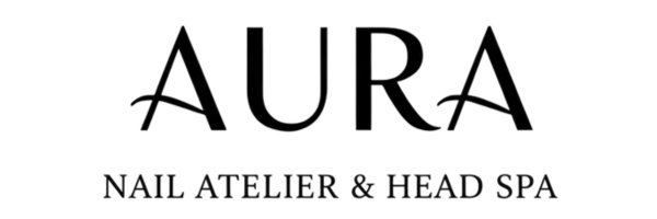 Sign for Nail Atelier & Head Spa with black background and white text.