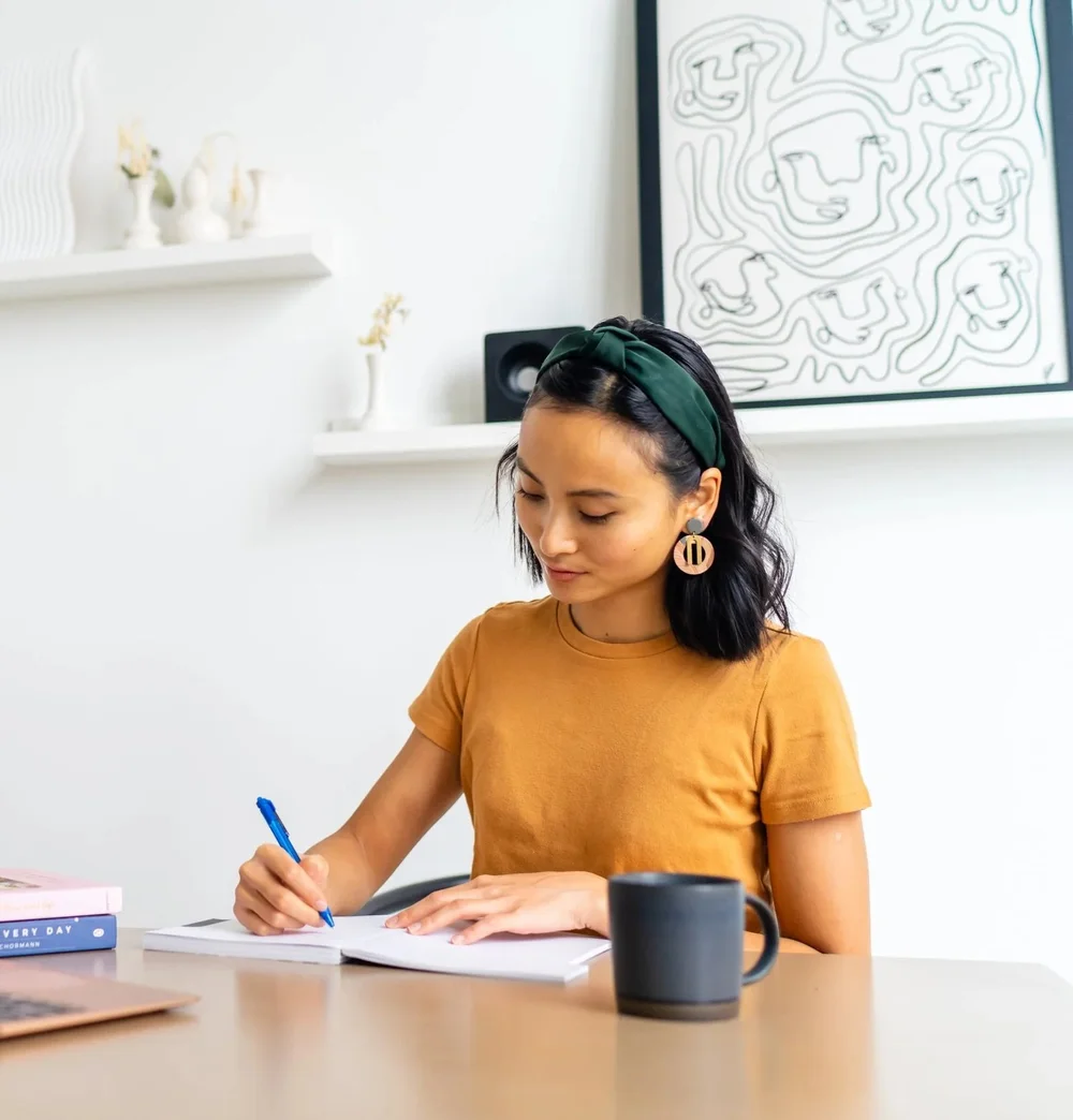 Trista Chan working at her desk