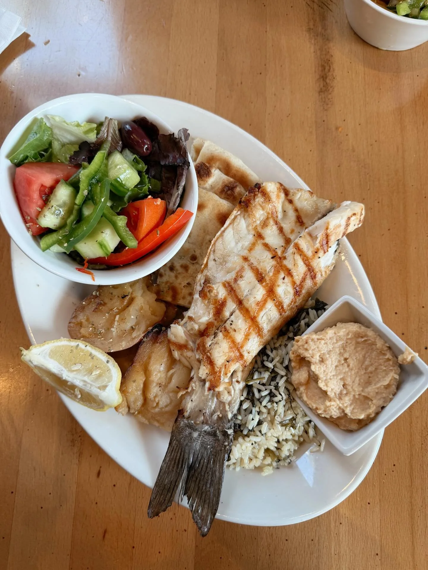Calamari, grape leaves, branzino, and ekberry. So fresh, so good. ✨#ethos #mediterraneanfood