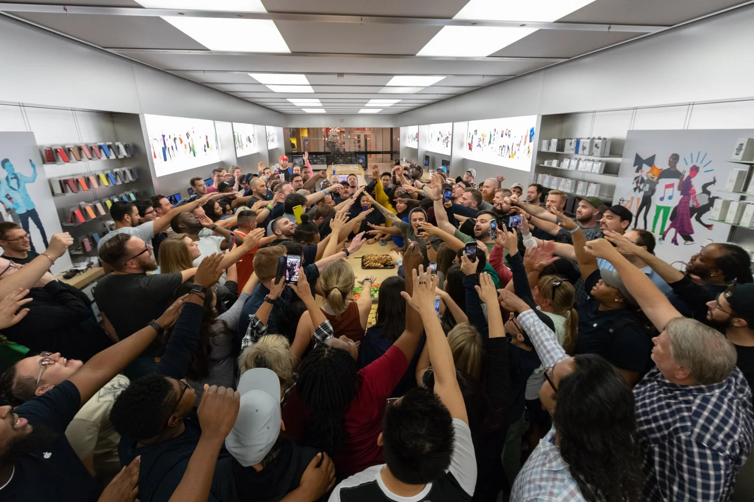 A group celebrating together around a table in a retail store