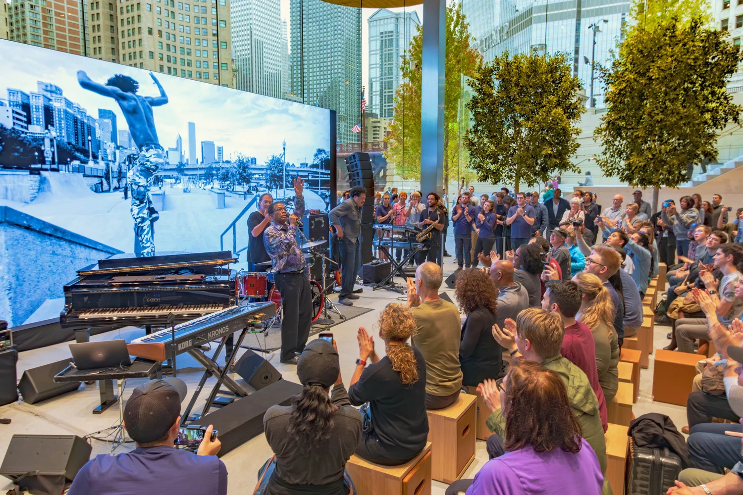 Guests gathered around a piano at a celebration