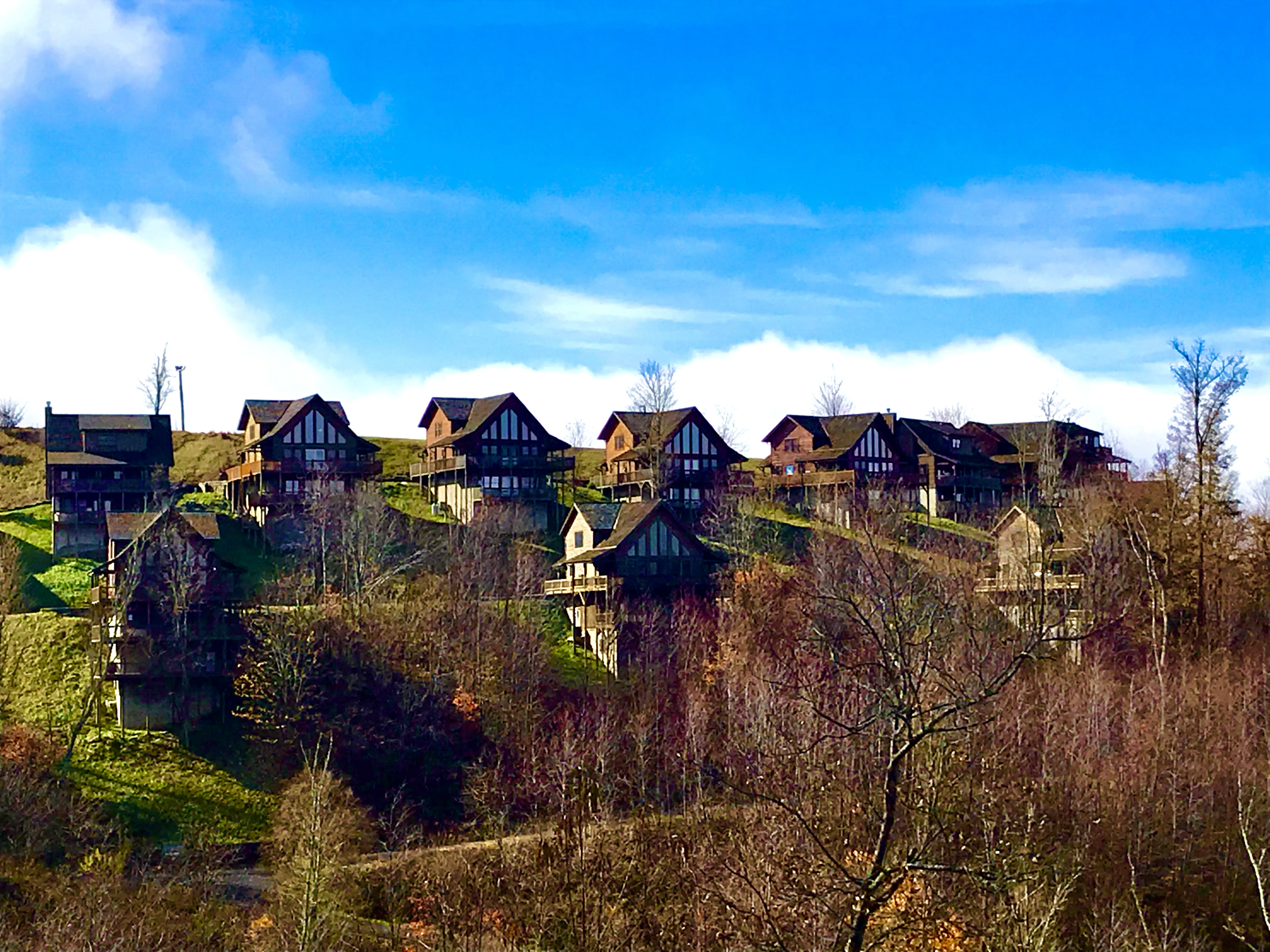 The pointed angles of the cabins blended with the rolling hills evoked stillness and calm. It was quiet. [Boone, NC].