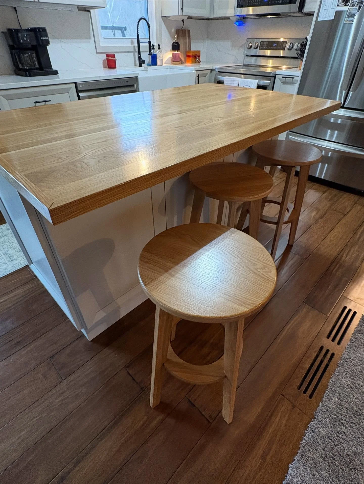 Custom made swivel bar stools to tie in the other White Oak details in this kitchen. Brings it all together!