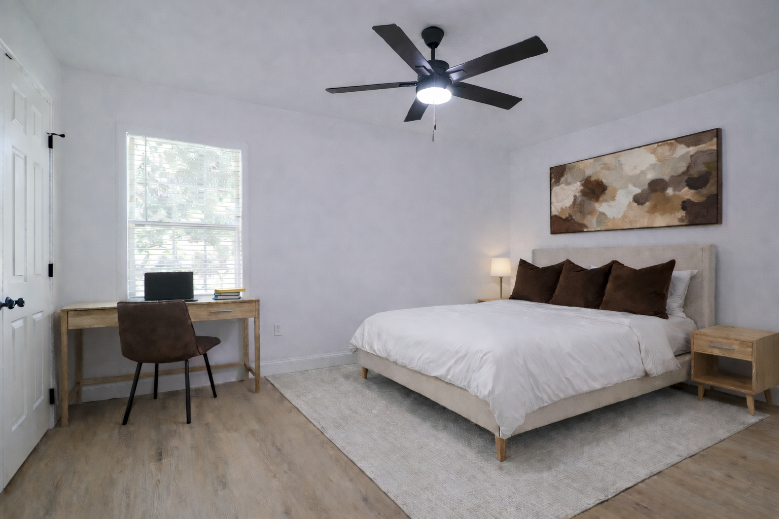 Modern bedroom with abstract art.png