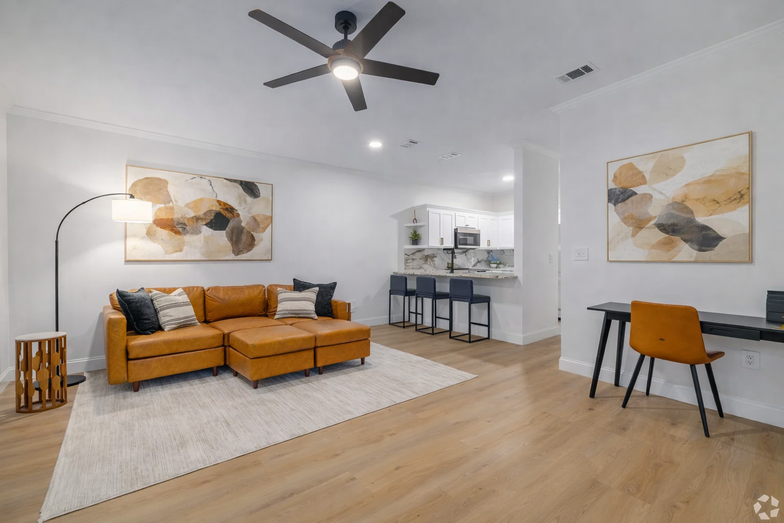 Modern living room with orange accents.png