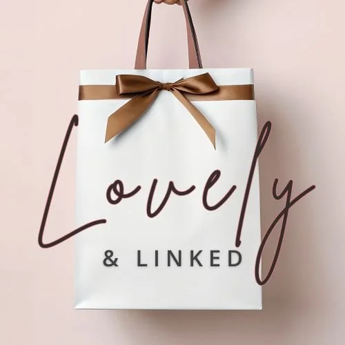 A white gift bag with a brown ribbon bow and handles, with the words 'Lovely & Linked' written on it.