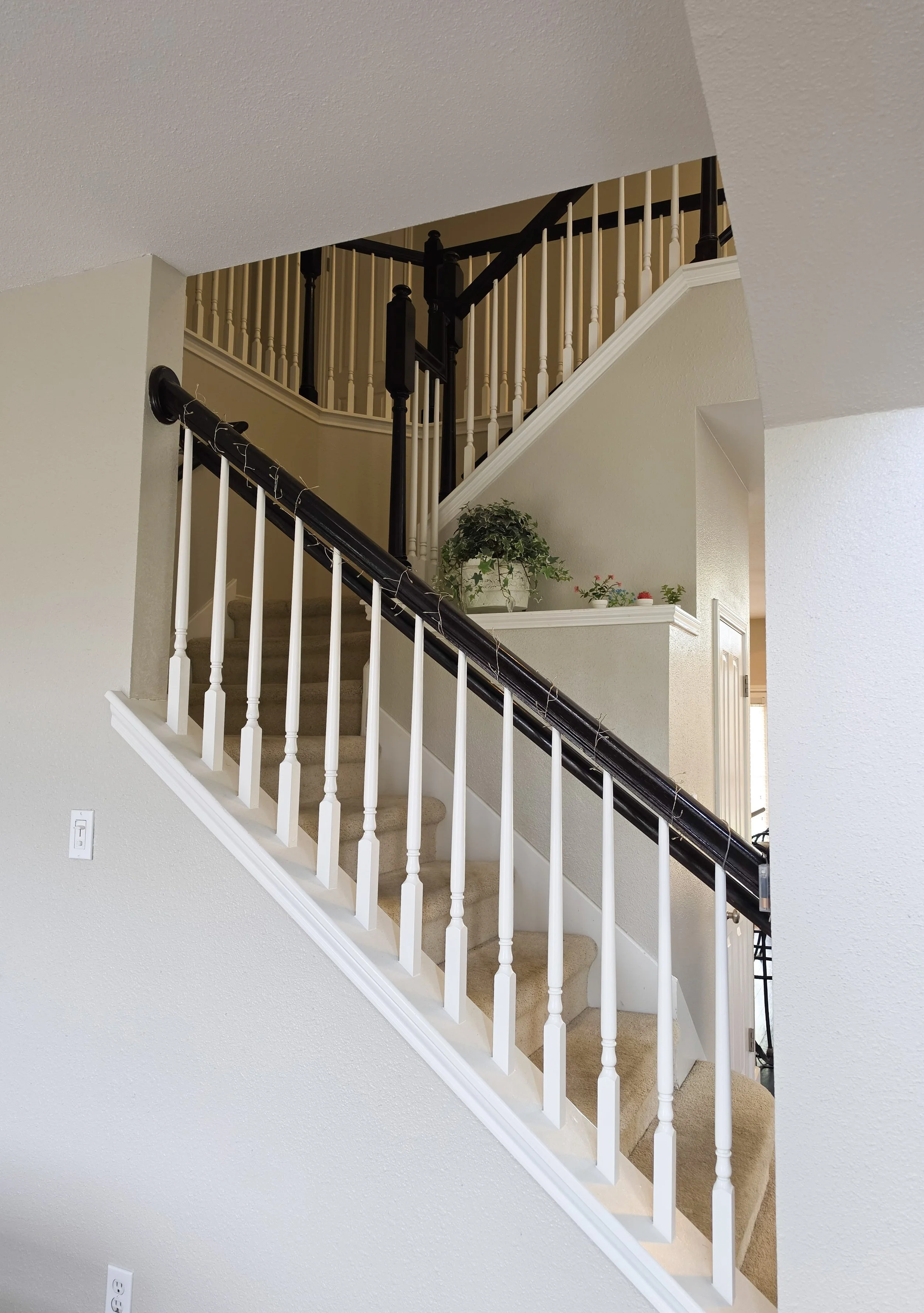 Interior view of a staircase at Fireside Sober Living.