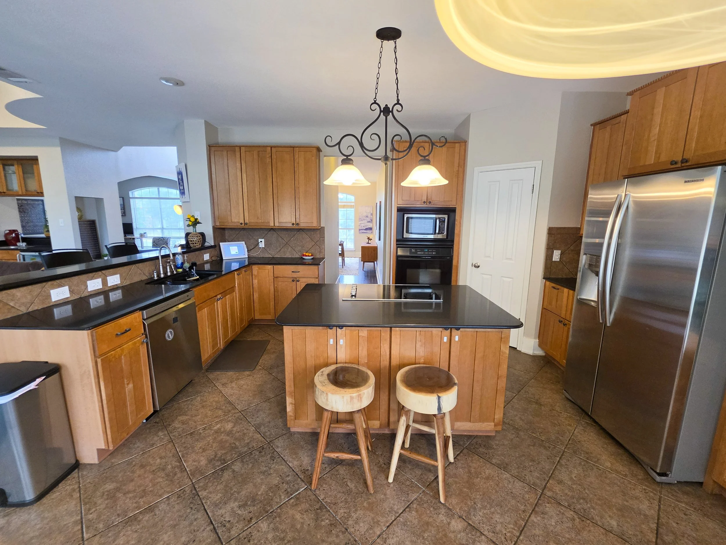 A large and open kitchen with stainless steel appliances at the Fireside house in Austin. Fireside Sober Living offers alternative, non-AA, non-traditional, AA, and traditional program modalities.