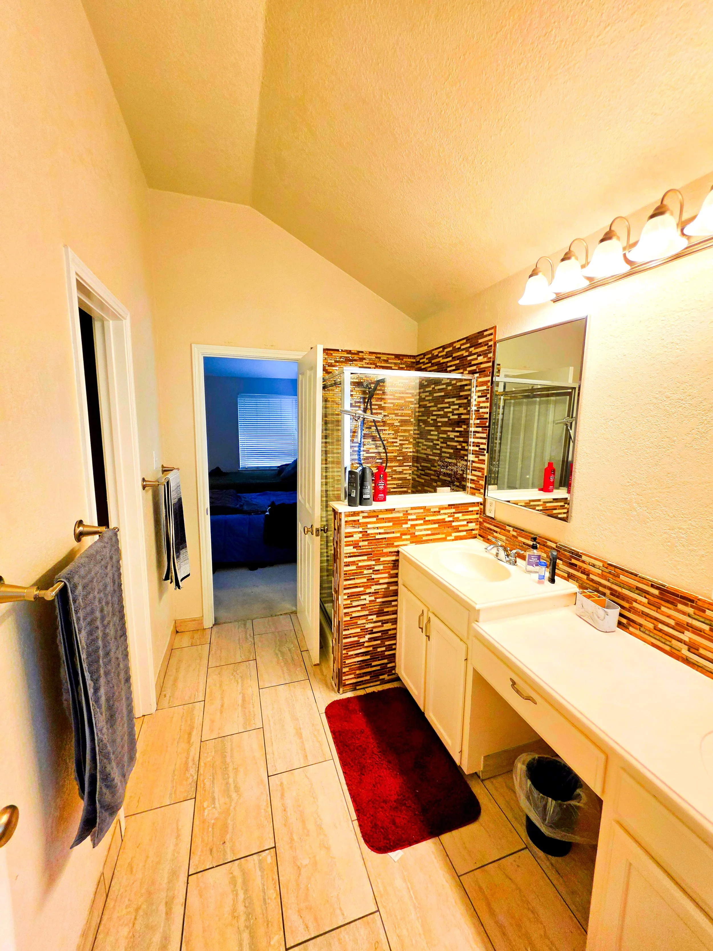 Large master bathroom on the second floor with tub, walk-in closet, and shower.
