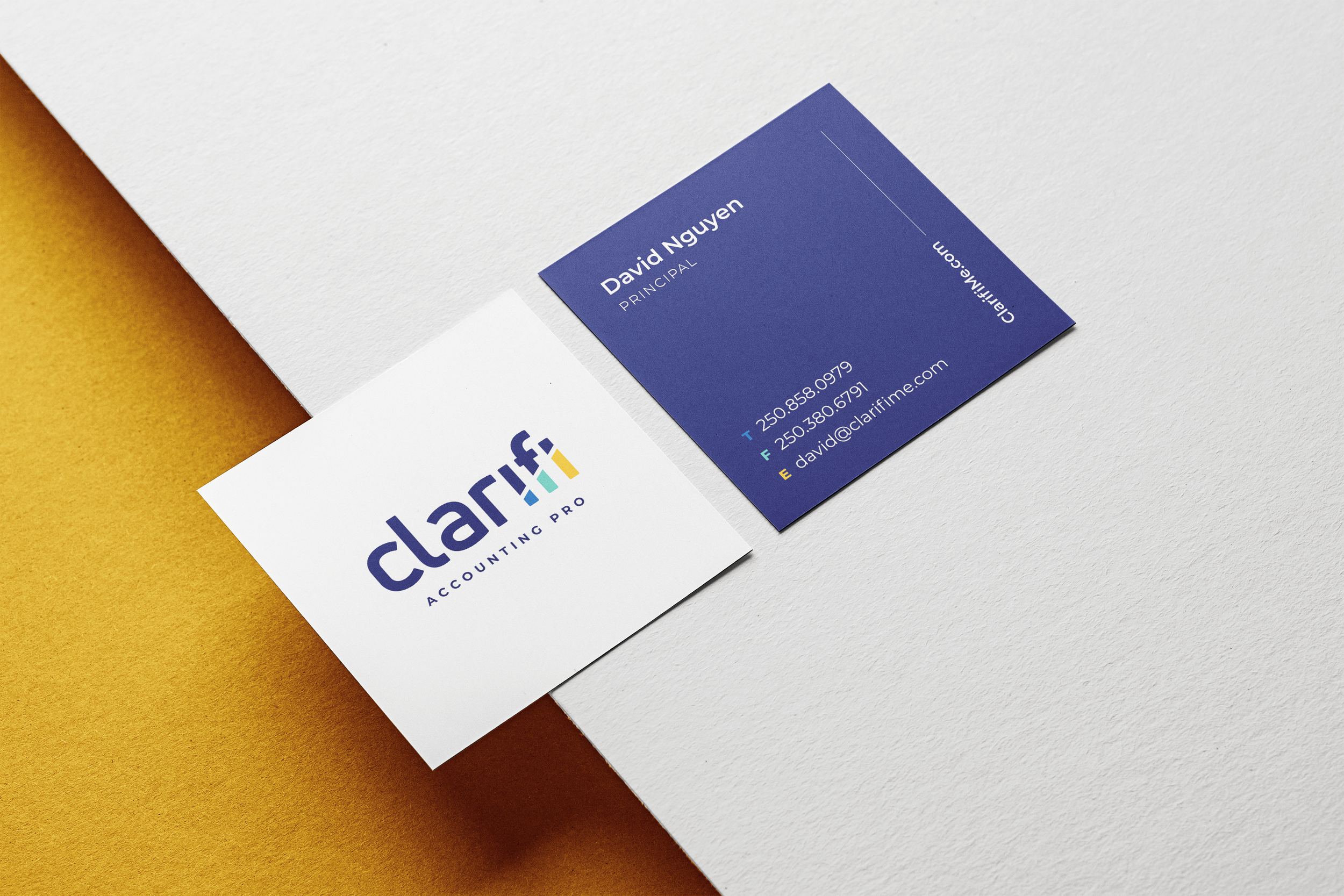 Business cards for Clarifi Accounting Pro, featuring a white card with the company logo and a blue card with the contact information for David Nguyen, Principal.