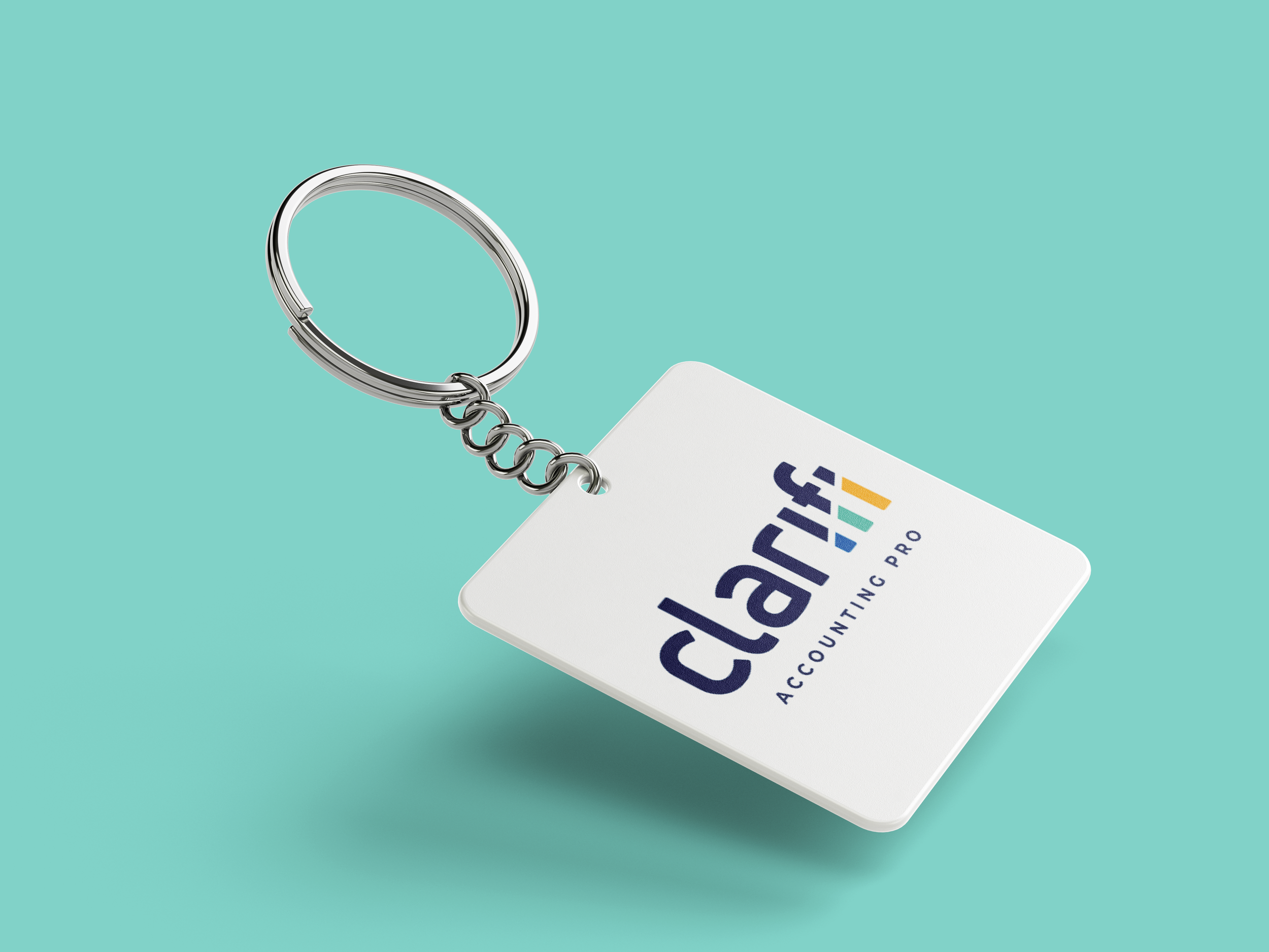 A keychain with a white square tag displaying the Clarisf Accounting Pro logo against a teal background.