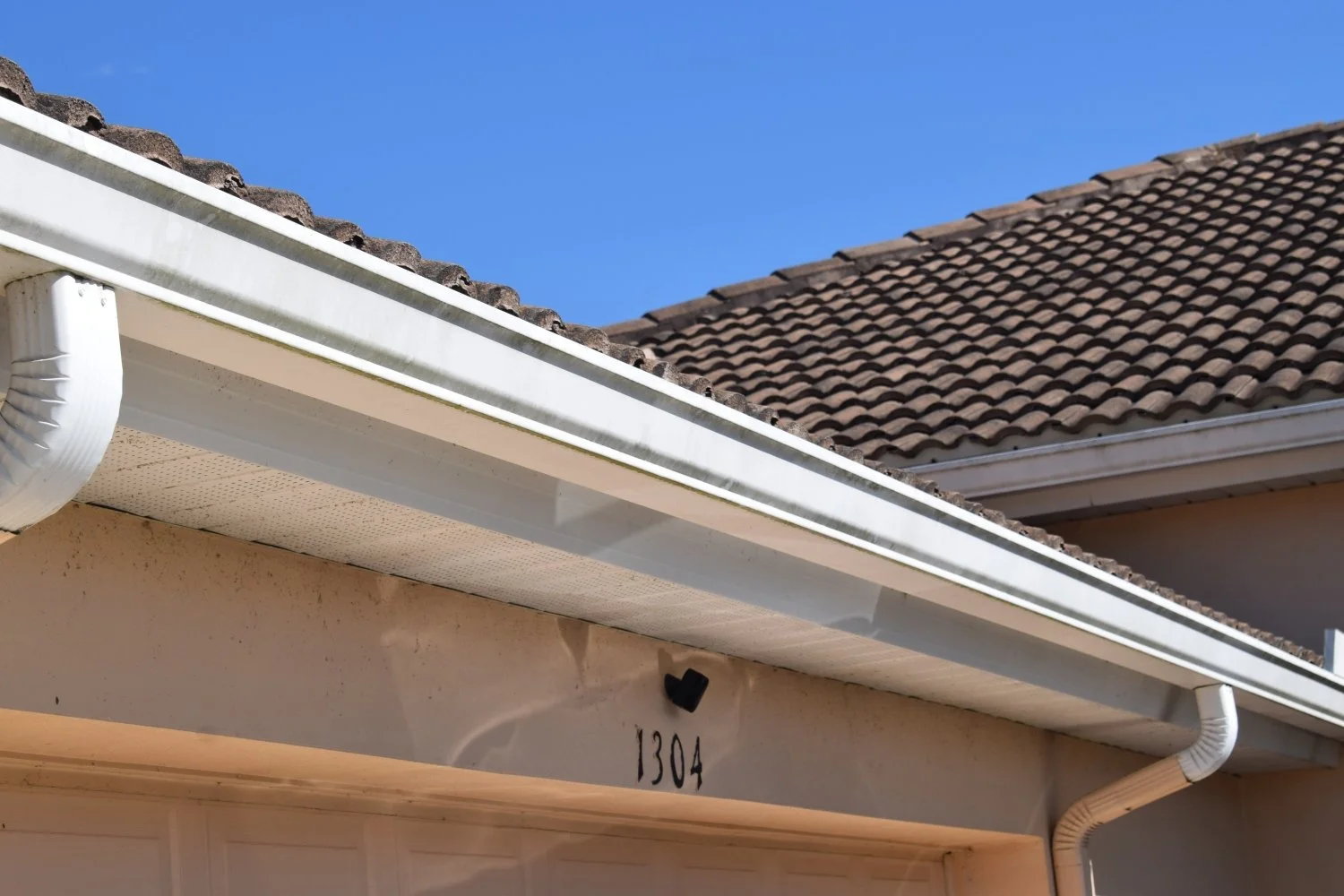 Soffit panels and gutters above the garage.JPG