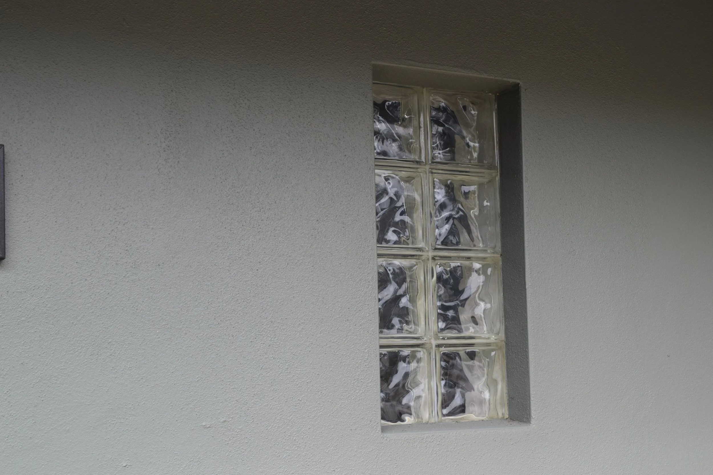Glass block windows on the front of the house.JPG