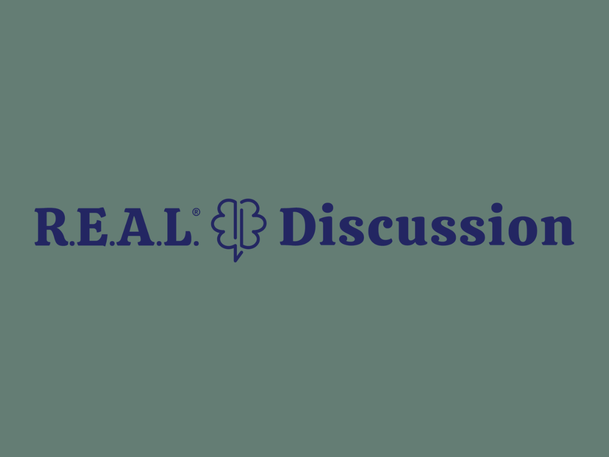 Text reading "R.E.A.L. Discussion" with a speech bubble shaped like a brain in the middle