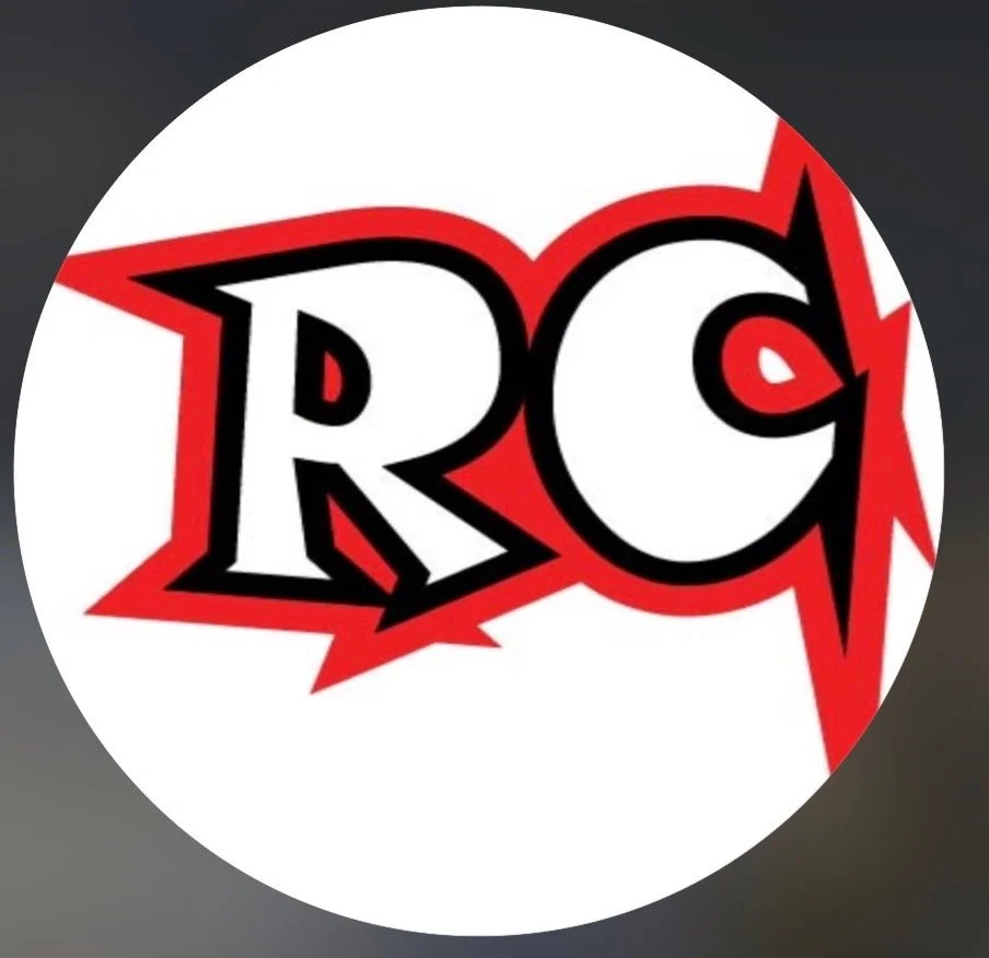 Comic-style logo with the letters 'RC' in bold black and white, surrounded by red lightning bolt accents.