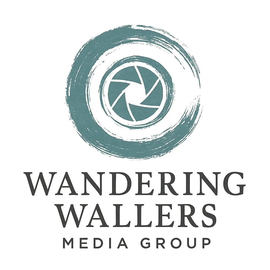 Logo of Wandering Wallers Media Group featuring a camera shutter symbol within a circular brushstroke, with the company name below.
